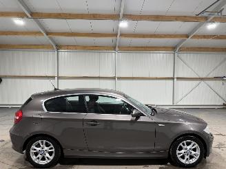 Damaged car BMW 1-serie 118d 100kW Airco Corporate Business Line 2009/1