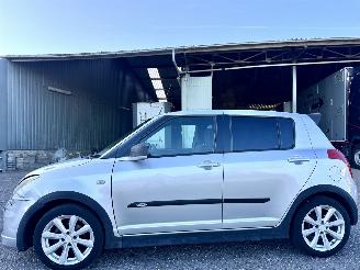 Unfallwagen Suzuki Swift 1.3i 92pk GLS 5drs - nap - airco - camera - touchscreen multimedia - bleutooth - alcantara hemel + stuur 2006/10